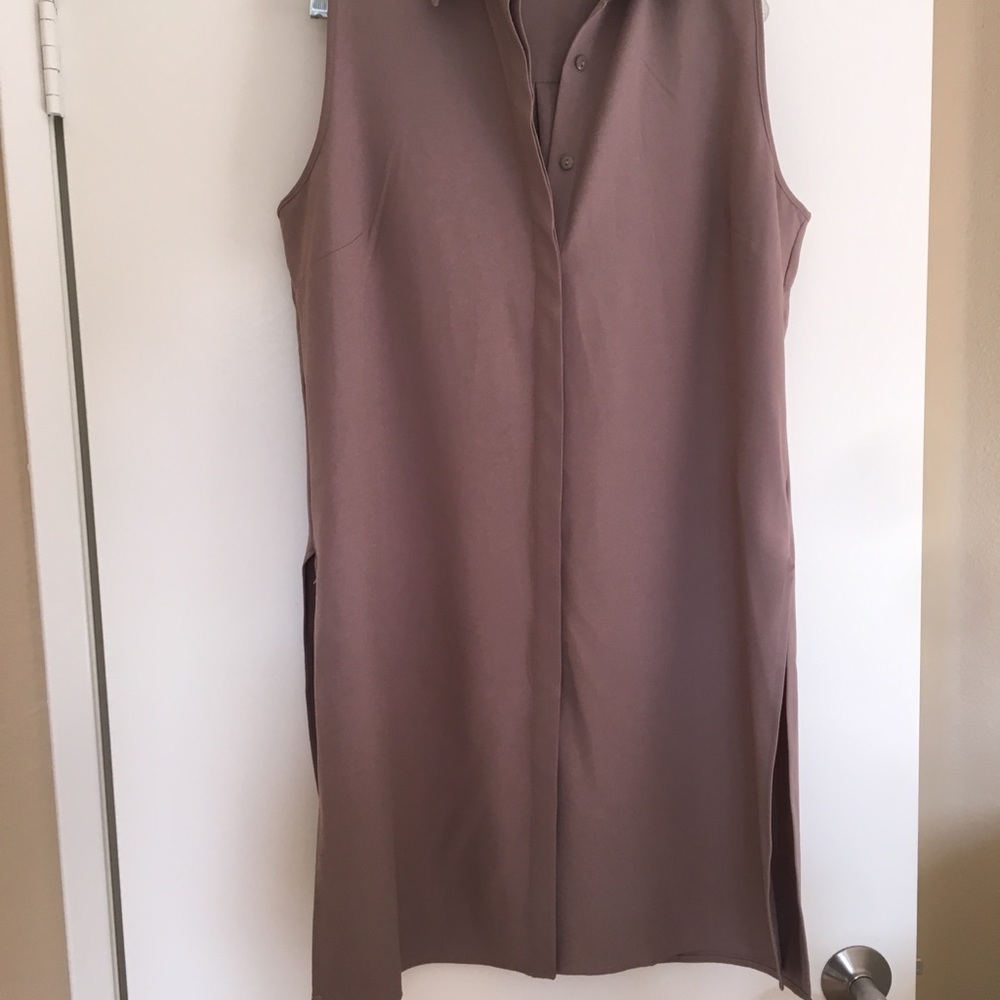 Taupe button up sleeveless tunic.